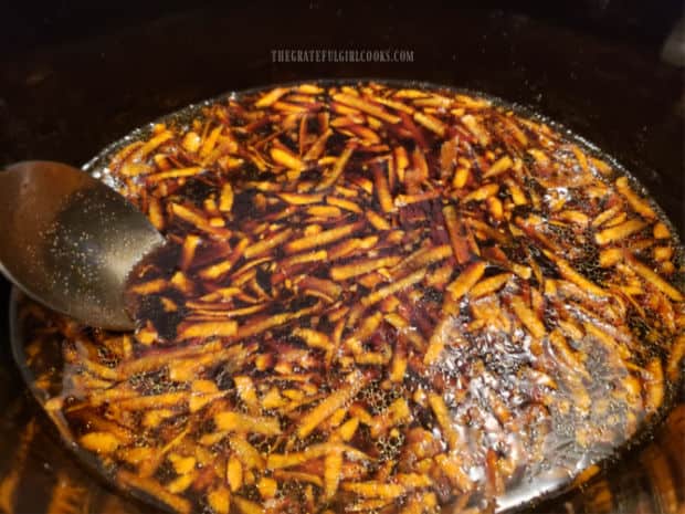 Sauce for the Mongolian beef is stirred to combine, before adding meat.