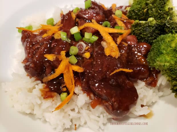 Steamed white rice and broccoli are served with the crock pot Mongolian beef.