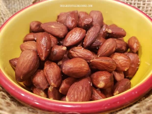 Easy Smoky Almonds are served in a pretty bowl.