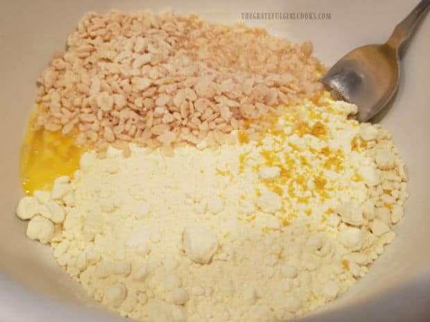 Cake mix, melted butter, puffed rice cereal, egg and lemon zest in a large mixing bowl.