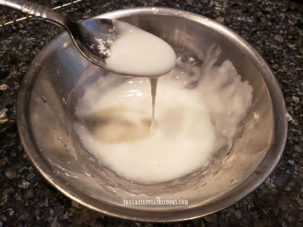 The lemon glaze is thin enough to drizzle onto the cooled cookies.