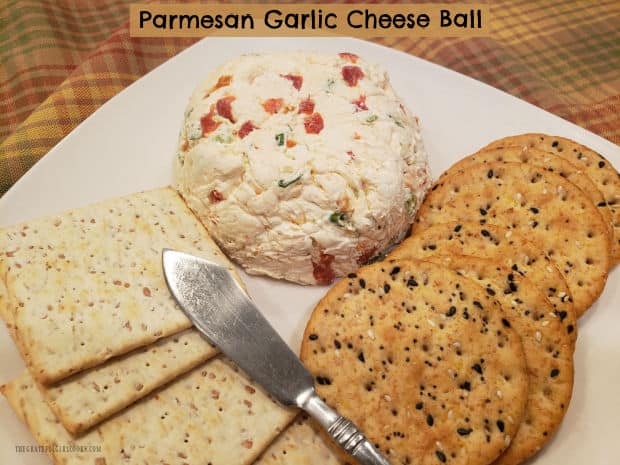 Make a Parmesan Garlic Cheese Ball for a snack, party or potluck! Simple to make, this yummy appetizer is spread on a variety of crackers!