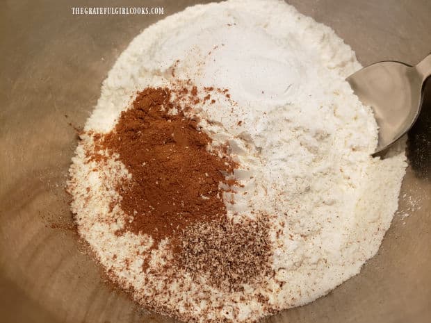 The dry ingredients, including flour and spices, are combined in a bowl.