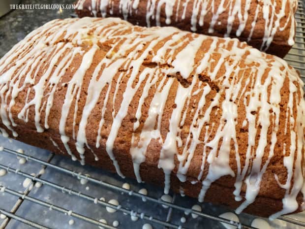 Each of the pear pecan bread loaves is drizzled with vanilla glaze.