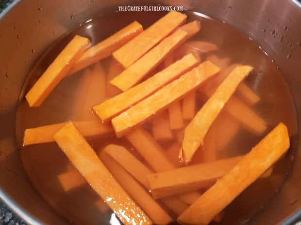 Soaking the sweet potatoes in water helps remove starches.