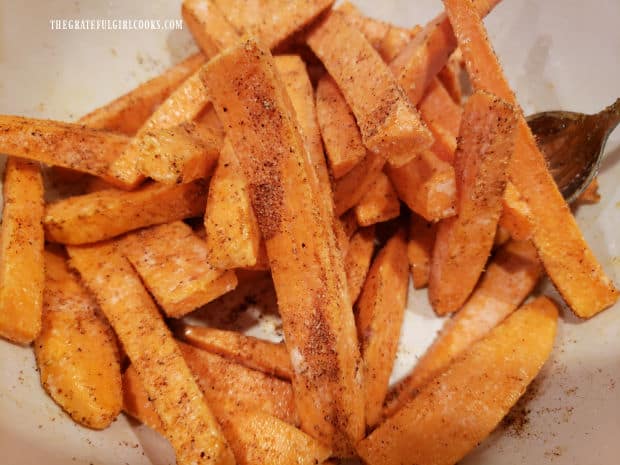 Spice mixture covers the sweet potato fries.