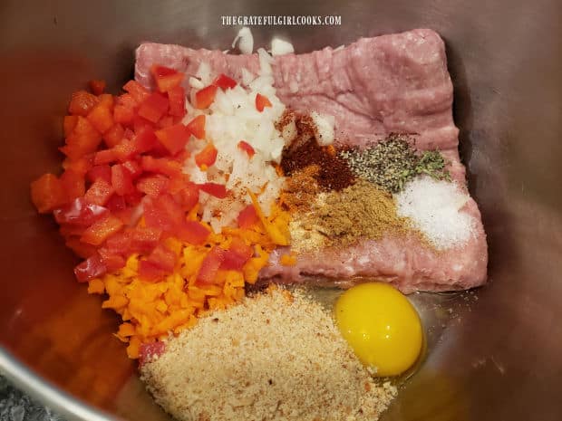 Ingredients for the TexMex turkey meatloaf are combined in a mixing bowl.
