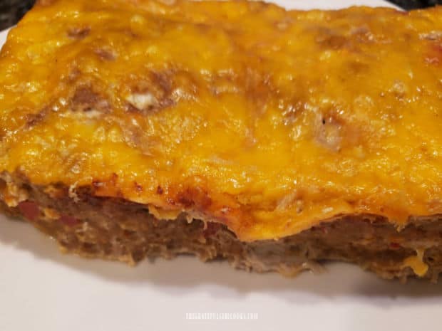 Topped with melted cheddar cheese, the baked TexMex Turkey Meatloaf is ready to slice and eat.
