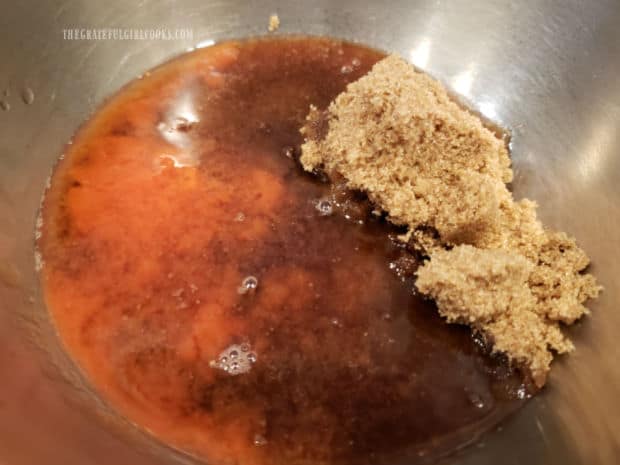 Brown sugar, hot sauce, cider vinegar and water are mixed in a small bowl to make a sauce.