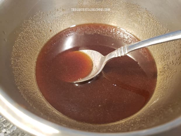 Bowl with the glazing sauce for the firecracker chicken meatballs.