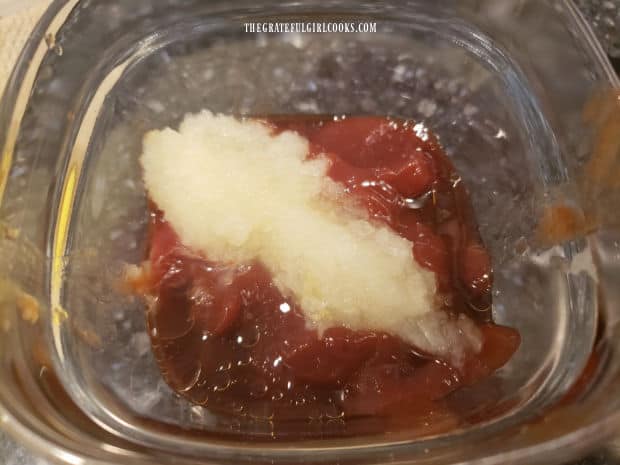 Ketchup, salt, Worcestershire sauce and grated onion are combined in a bowl.