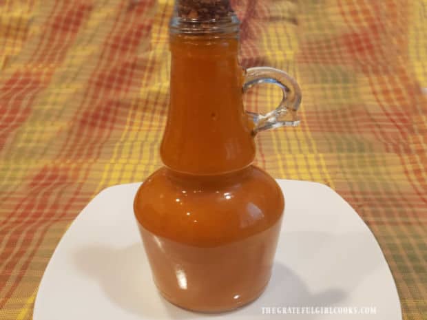 The homemade French salad dressing is transferred to a serving jar once done.