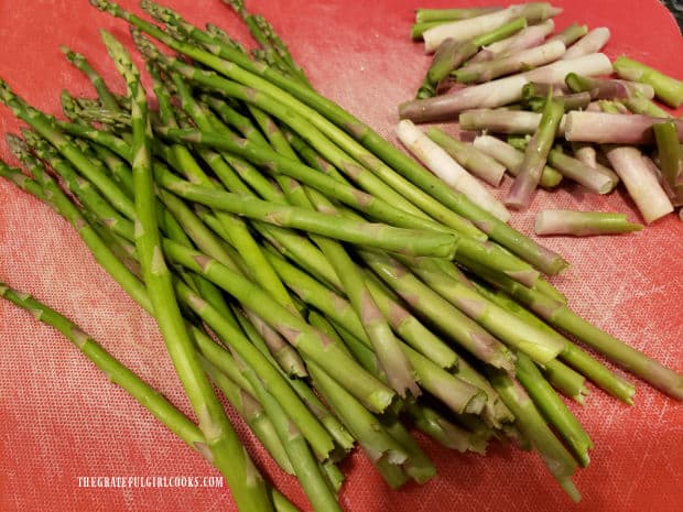 Before cooking, the tough ends of the asparagus stalks are removed.