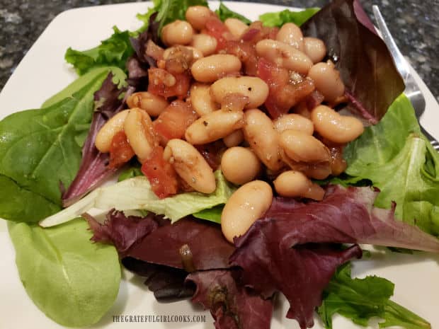 Cannellini Bean Salad with tomatoes, onion, olive oil, balsamic, vinegar and garlic is easy to make and delicious as a salad topper OR a dip!