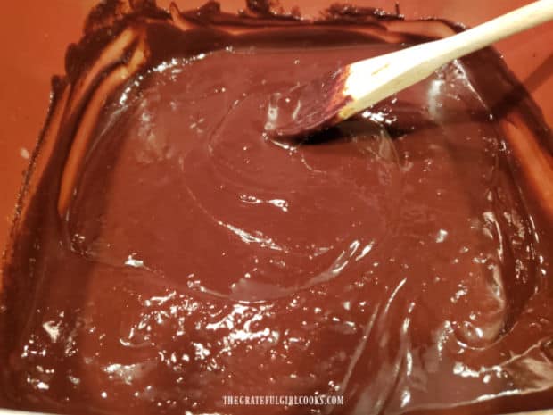 The chocolate mixture is stirred until all chocolate has melted and mixture is smooth.