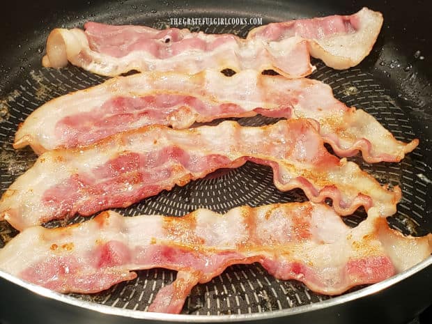 Bacon is cooked in skillet until nice and crispy, and it can be crumbled.