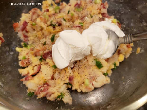 Sour cream is added to the potato mixture before stuffing it into the potatoes.