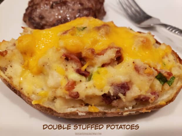Double Stuffed Potatoes are a tasty side dish! Potato skins are filled with mashed potatoes, sour cream, bacon, cheese, butter and scallions!
