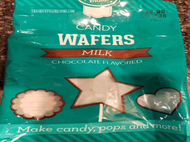 Chocolate candy wafers are melted to use to make round spheres for hot cocoa bombs.