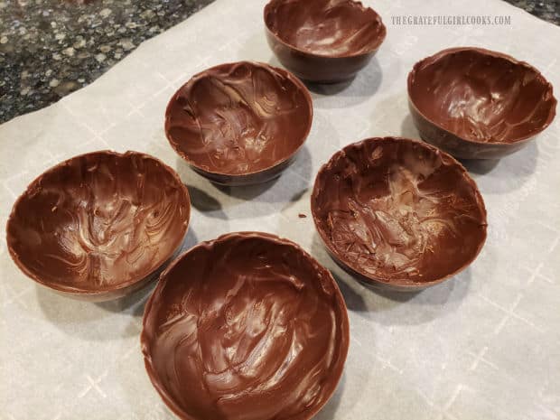 After two coats of melted chocolate, the spheres are ready to fill.