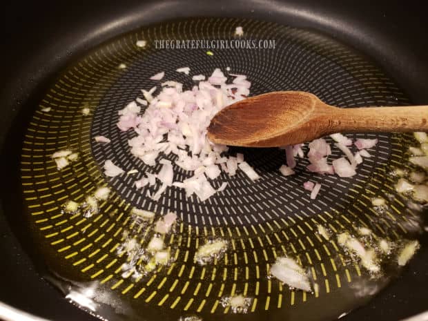 Minced shallots, cooking in olive oil in large skillet.