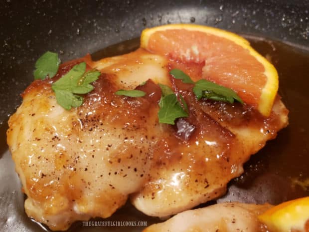 One of the orange Dijon chicken breasts, garnished and ready to serve.