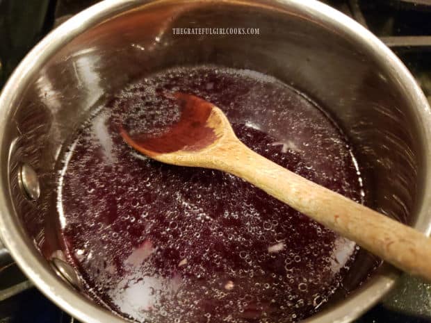 Red wine and beef broth are added to the saucepan to make a reduction sauce.
