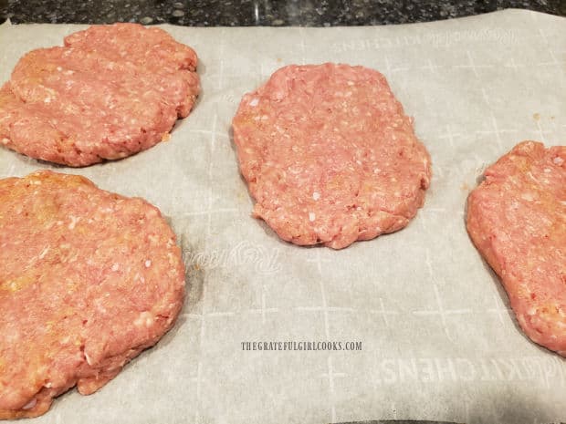 Four patties are made out of the ground turkey mixture.