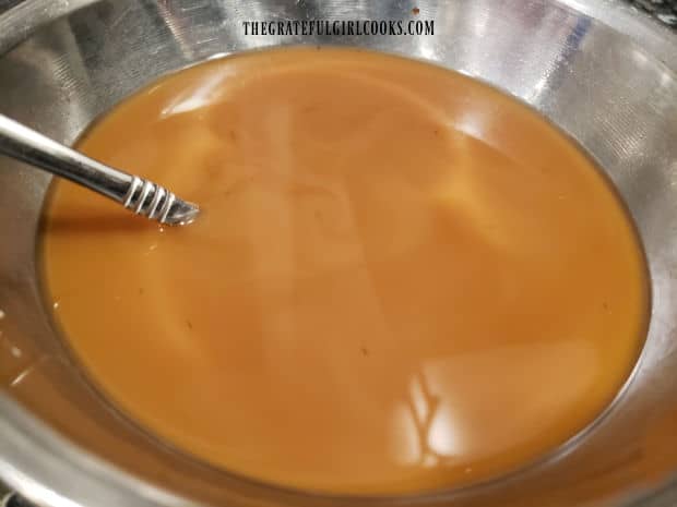 Sauce is mixed together to pour over cooked turkey patties.