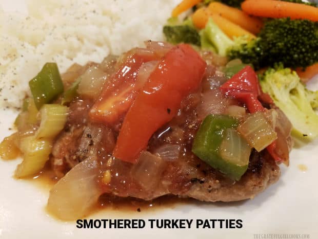 Smothered Turkey Patties are pan-seared, then cooked in an easy to make sauce with onions, bell peppers, tomatoes and celery.