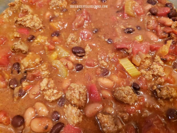 Pinto and black beans are added, to finish the tasty turkey chili.