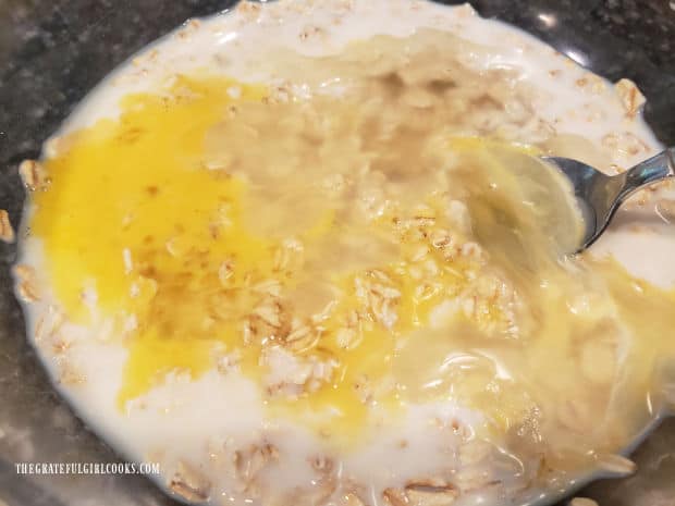 Egg and melted shortening are stirred into the rolled oat mixture which has been soaking.