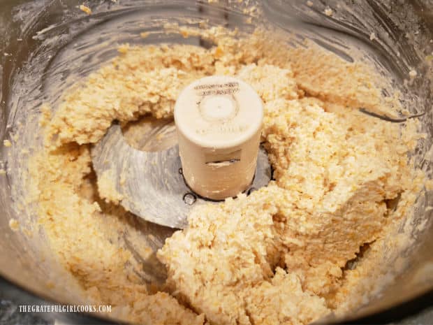 A food processor is used to process the cheese spread until smooth.