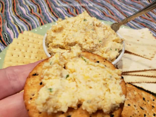 Spread on a cracker, the cheddar jack cheese spread is ready to eat.