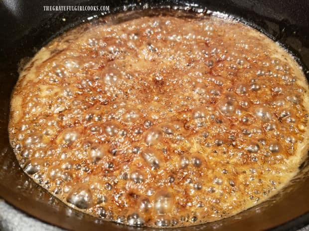 Garlic honey sauce for the shrimp, cooking in a cast iron skillet.