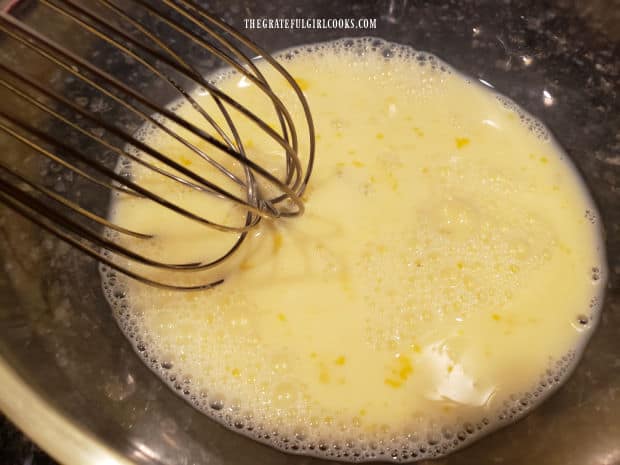 Egg and milk are whisked together as an egg wash for rockfish fillets.