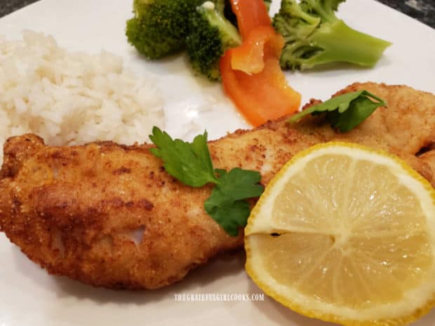 One of the rockfish fillets, served with broccoli and rice on the side.