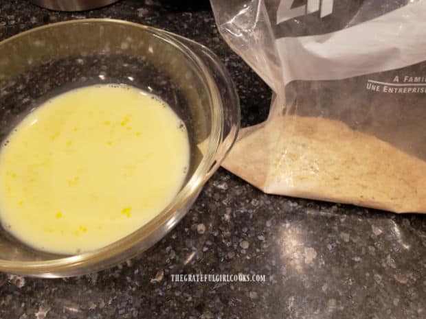 The egg wash and seasoning mixture is ready to coat the fish fillets before cooking.