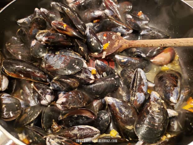 Mussels are added to skillet with veggies and steamed for 4-5 minutes.