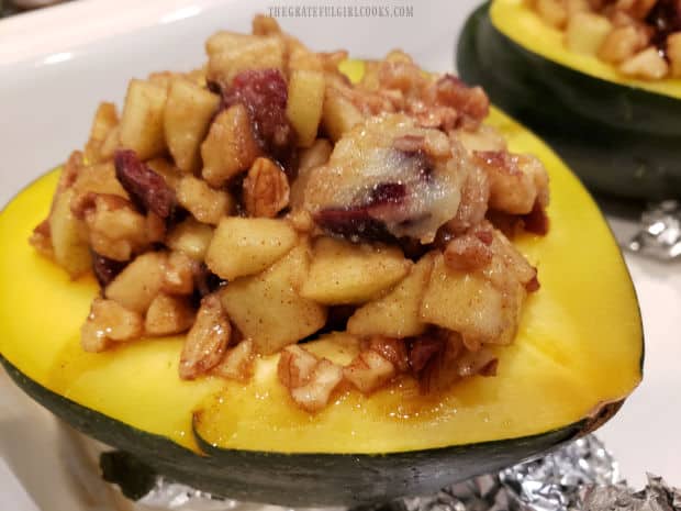 Each of the squash halves are filled with the apple pecan mixture before baking again.