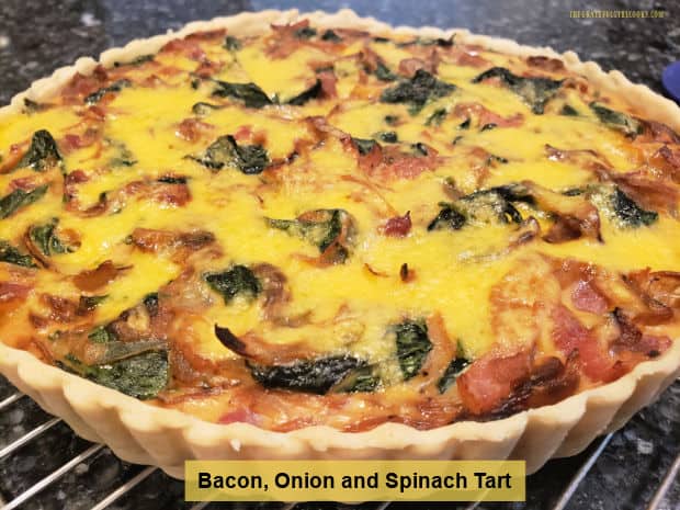 Enjoy a Bacon, Onion and Spinach Tart for breakfast, lunch or dinner! It's yummy, and filled with caramelized onions, cheese, spinach & bacon.