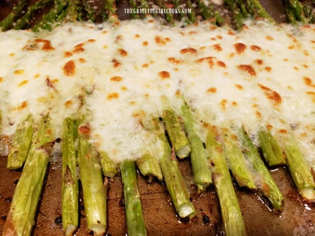 Cheesy Garlic Roasted Asparagus, hot out of the oven, and ready to serve.