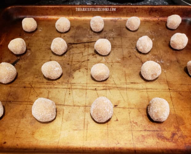 Sugar-coated dough balls are placed on baking sheets 2" apart.