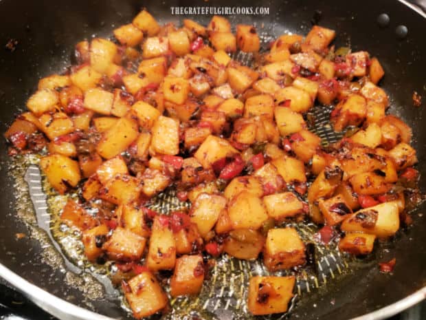 Country skillet potatoes cook a few more minutes (uncovered) to crisp up the potatoes.