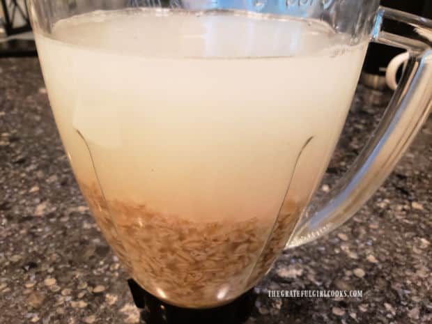 Oats, honey, salt and water in the blender before mixing.