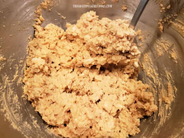 After combining ingredients, the cookie dough is ready to shape into balls and bake.