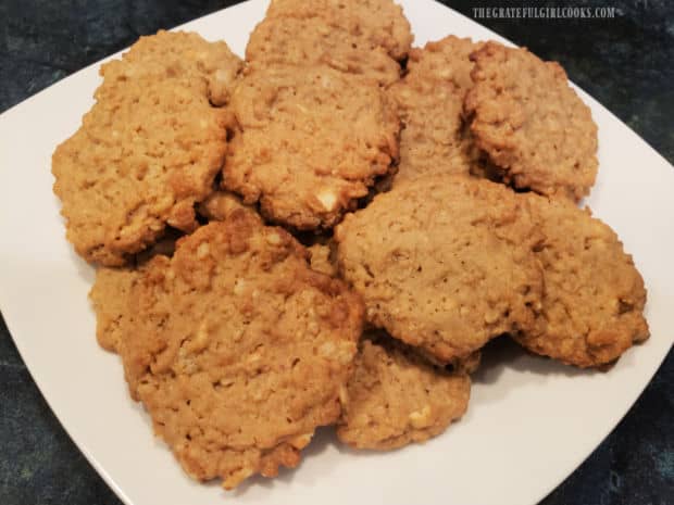 A white plate, full of peanut butter crunch cookies, ready to eat.