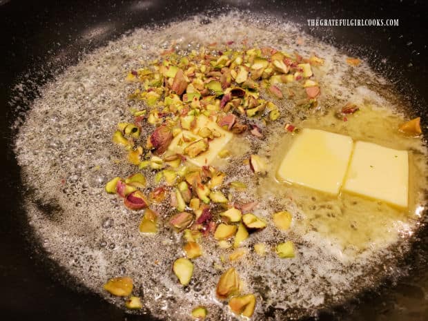 Chopped pistachios are cooked in butter until browned.