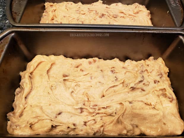 Batter for the snickerdoodle bread is divided into loaf pans.