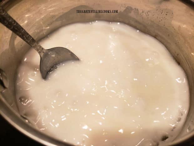 Sugar, cornstarch, salt and milk cook in a saucepan until thickened and bubbly.